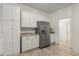 Bright kitchen with stainless steel appliances and granite countertops offers plentiful cabinet storage at 187 Tall Pines Pass, Kissimmee, FL 34759