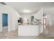 Bright eat-in kitchen featuring granite countertops and an island with a sink and breakfast bar at 187 Tall Pines Pass, Kissimmee, FL 34759