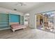 Versatile living space with built-in shelving, Murphy bed, and seamless access to outdoor patio at 187 Tall Pines Pass, Kissimmee, FL 34759