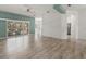 Bright, open living space leading to an outdoor patio and adjacent to the kitchen at 187 Tall Pines Pass, Kissimmee, FL 34759