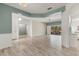 Spacious open-concept living room leading to kitchen and outdoor patio area at 187 Tall Pines Pass, Kissimmee, FL 34759