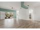 Open-concept living space with neutral tones and access to the patio at 187 Tall Pines Pass, Kissimmee, FL 34759