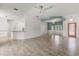 Open living space with stylish lighting, partition wall, and tile flooring at 187 Tall Pines Pass, Kissimmee, FL 34759