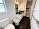 Modern bathroom featuring black marble floors, a double sink vanity, and a separate toilet and bidet at 1931 N Portillo Dr, Deltona, FL 32738