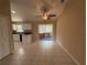 Bright dining area with tile floors, slider doors to patio and entry to kitchen at 1931 N Portillo Dr, Deltona, FL 32738