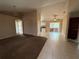 Open-concept living space with living room, dining area, tile flooring, and neutral paint at 1931 N Portillo Dr, Deltona, FL 32738