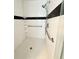 Bright shower featuring tile and handrails for accessibility and safety at 1931 N Portillo Dr, Deltona, FL 32738