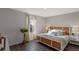 Bright bedroom with a stylish bed, plants, and natural light at 2060 Monteverde Ave, Davenport, FL 33837