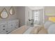 Relaxing bedroom with dresser and workstation, offering a comfortable living space at 2060 Monteverde Ave, Davenport, FL 33837