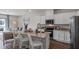Kitchen and living room featuring a kitchen island, stainless appliances, and modern design at 2064 Monteverde Ave, Davenport, FL 33837