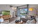 Bright living room with stylish decor, modern furniture, and sliding glass doors to outdoor space at 2064 Monteverde Ave, Davenport, FL 33837