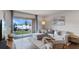 Bright living room with a comfortable sectional sofa, a large window, and stylish decor at 2064 Monteverde Ave, Davenport, FL 33837