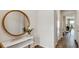 Stylishly decorated entryway featuring a modern console table and round mirror at 2068 Monteverde Ave, Davenport, FL 33837