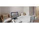 Cozy home office featuring a white desk, comfortable seating, and a modern computer setup at 2068 Monteverde Ave, Davenport, FL 33837