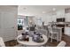 Open-concept kitchen with modern appliances, large island and breakfast bar, flowing into the living area at 2068 Monteverde Ave, Davenport, FL 33837
