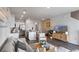 Open-concept living area with modern decor, kitchen island, and a comfortable seating arrangement at 2068 Monteverde Ave, Davenport, FL 33837