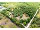 Aerial view of the wooded lot and adjacent road at 2320 Red Ember Rd, Oviedo, FL 32765