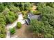 Beautiful lot with lush trees surrounding the home and detached garage with an extra long private driveway at 2320 Red Ember Rd, Oviedo, FL 32765