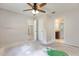 Bedroom featuring bare floors, several doors, and a ceiling fan with lights at 2320 Red Ember Rd, Oviedo, FL 32765