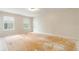 Bright bedroom with large windows and plywood subfloor, ready for customization at 2320 Red Ember Rd, Oviedo, FL 32765