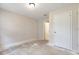 Bedroom with a bare floor, one window, and doorways to other rooms at 2320 Red Ember Rd, Oviedo, FL 32765