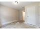 Clean, neutral bedroom with a closet, ready for personalization and design at 2320 Red Ember Rd, Oviedo, FL 32765