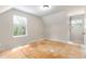 Attic bedroom with windows on either side of the room and bare flooring at 2320 Red Ember Rd, Oviedo, FL 32765