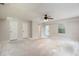 Spacious bonus room with a ceiling fan and natural light, ready for your creativity at 2320 Red Ember Rd, Oviedo, FL 32765