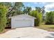 Detached two-car garage on the property and large, concrete driveway outside the garage at 2320 Red Ember Rd, Oviedo, FL 32765
