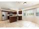 Kitchen featuring stainless steel appliances, dark wood cabinets, an island and tile flooring at 2320 Red Ember Rd, Oviedo, FL 32765