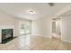 Bright living area features tile flooring, fireplace with green marble, and access to a backyard at 2320 Red Ember Rd, Oviedo, FL 32765
