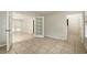 Spacious living room with tile floors and French doors leading to the backyard at 2320 Red Ember Rd, Oviedo, FL 32765