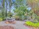 Backyard landscaping including an outdoor dining area and native plants at 2350 Worthington Rd, Maitland, FL 32751