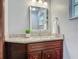 A modern bathroom vanity with a granite countertop and silver fixtures at 2350 Worthington Rd, Maitland, FL 32751