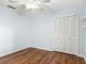 Bedroom with wood floors, a ceiling fan, and a closet for storage at 2350 Worthington Rd, Maitland, FL 32751