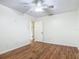 Bright bedroom with a ceiling fan and wood-look flooring at 2350 Worthington Rd, Maitland, FL 32751