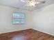 Bedroom featuring a window and wood-look flooring, and ceiling fan at 2350 Worthington Rd, Maitland, FL 32751