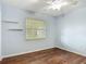 Bedroom with wood floors, a ceiling fan, and a window providing ample natural light at 2350 Worthington Rd, Maitland, FL 32751