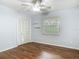 Bedroom with wood floors, a ceiling fan, and a large closet for storage at 2350 Worthington Rd, Maitland, FL 32751