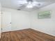 Bedroom featuring a ceiling fan, a window, and wood-look floors at 2350 Worthington Rd, Maitland, FL 32751