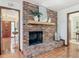 Close-up of brick fireplace with decorative mantle and hearth, perfect for cozy evenings in the living room at 2350 Worthington Rd, Maitland, FL 32751