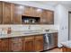 Modern kitchen featuring granite countertops, stainless steel appliances, and custom wood cabinetry at 2350 Worthington Rd, Maitland, FL 32751