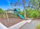 Playground with wood chips and a slide for outdoor fun at 2350 Worthington Rd, Maitland, FL 32751