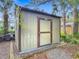 An exterior shed with a brown door at 2350 Worthington Rd, Maitland, FL 32751