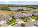 Aerial view of a house with pond and wooded views in a suburban neighborhood at 2431 Knoll Dr, Apopka, FL 32712