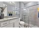 Bathroom showcasing granite countertop vanity and tile shower at 2431 Knoll Dr, Apopka, FL 32712
