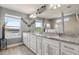 Bathroom features a large vanity with dual sinks and a view of the lake at 2431 Knoll Dr, Apopka, FL 32712