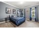 Bedroom featuring a plush bed, gaming posters, exercise equipment and natural light from large windows at 2431 Knoll Dr, Apopka, FL 32712