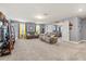 Large bonus room features neutral paint, plush carpeting and plenty of natural light at 2431 Knoll Dr, Apopka, FL 32712
