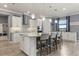 Bright kitchen featuring a granite island, stainless steel appliances, and pendant lighting at 2431 Knoll Dr, Apopka, FL 32712